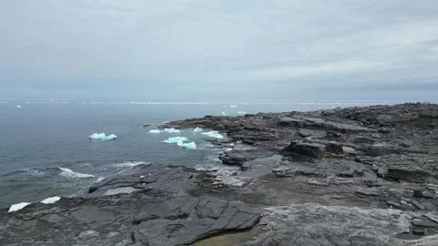 Drone Flight Over Rugged North Newfoundland Coast with Ice Fragments Stock Footage 253218374