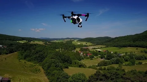 Drone in flight over rural landscape Stock Footage 77387652