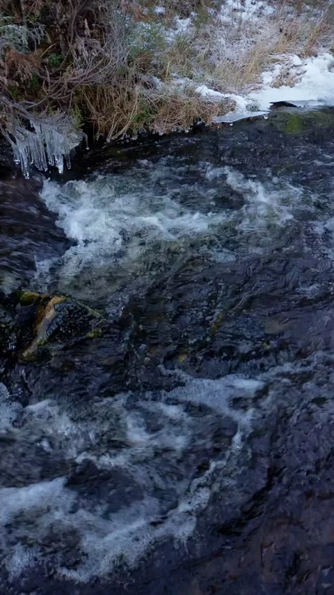 Drone flight over a rushing water creek, winter feeling. Stock-Footage 319501149
