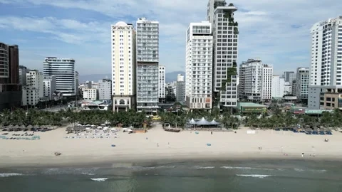 Drone flight over the sandy beach with the streets and hotels 5 Video stock 251980088