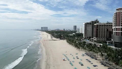 Drone flight over the sandy beach with the streets and hotels 4 Video stock 251980797