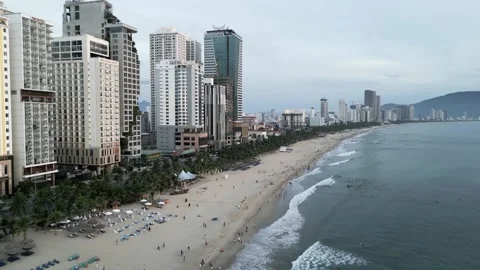 Drone flight over the sandy beach with the streets and hotels 1 Video stock 251982967