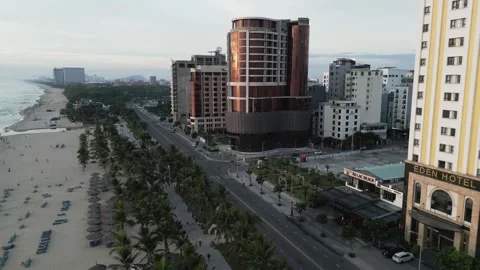 Drone flight over the sandy beach with the streets and hotels 3 Video stock 251983304