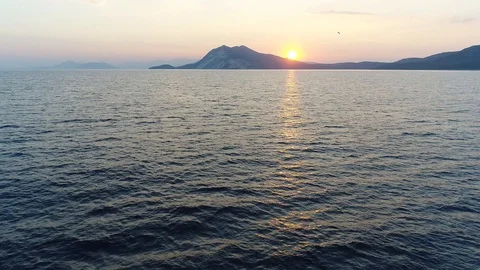 Drone flight over the sea at sunset Stock Footage 104283281