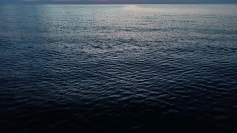 Drone flight over the sea surface before dawn, Turkey, Kemer 4k Stock Footage 214770180