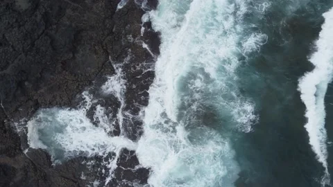 Drone flight over sea waves crashing on the rocky coast of Fuerteventura Spain Stock Footage 201809138