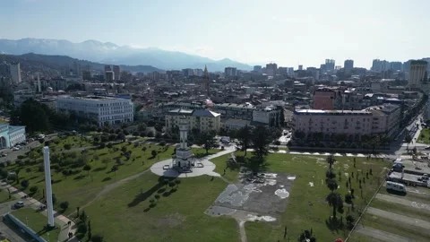 Drone flight over the seaport and the city on a summer sunny day. Aerial view Stock Footage 256158569