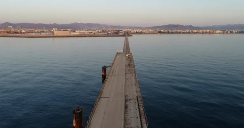 Drone flight over serene and calm Mediterranean sea approaching the harbor Stock Footage 124222535