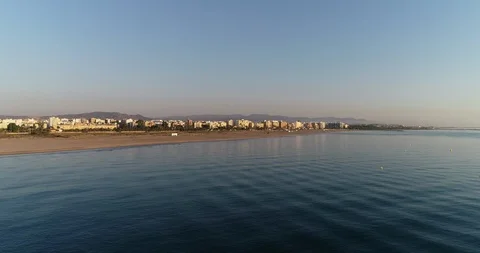 Drone flight over serene and calm  sea approaching the harbor Stock Footage 124223244