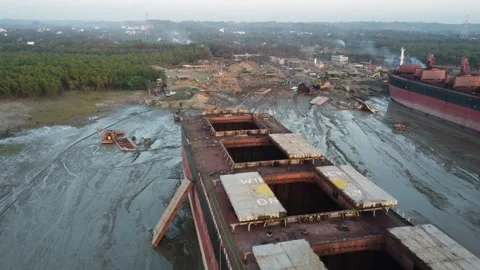 Drone Flight Over Ship with Open Cargo Holds at Shipbreaking Yard in Bangladesh Stock Footage 327442446