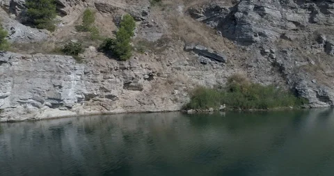 Drone flight over small lagoon in inland Stock Footage 93392554