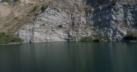 Drone flight over small lagoon in inland Stock Footage 93392645