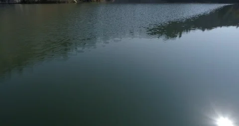 Drone flight over small lagoon in inland Stock Footage 93392894