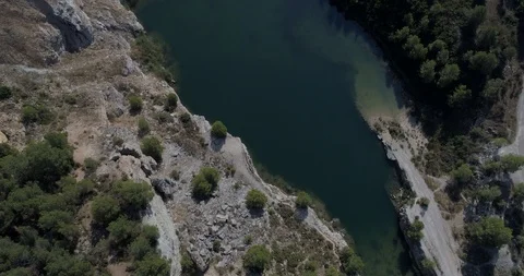 Drone flight over small lagoon in inland Stock Footage 93393213