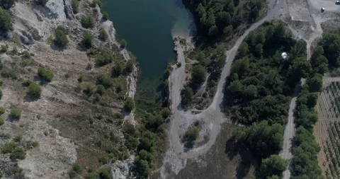Drone flight over small lagoon in inland Stock Footage 93393620