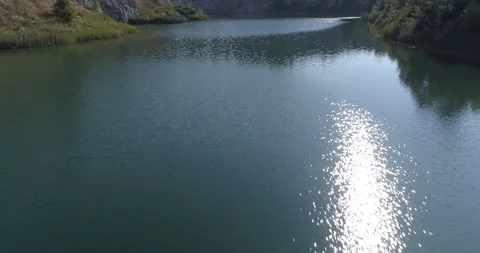 Drone flight over small lagoon in inland Stock Footage 93393777