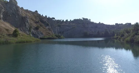 Drone flight over small lagoon in inland Stock Footage 93393953