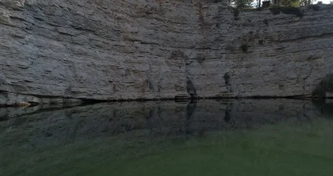 Drone flight over small lagoon in inland Stock Footage 93394199