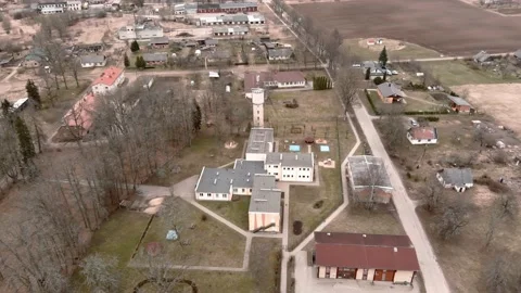 Drone flight over small rural vilage Umurga during spring time, Latvia 動画素材 152715990