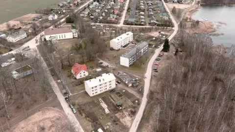 Drone flight over small rural vilage Umurga during spring time, Latvia 動画素材 152716867