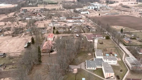 Drone flight over small rural vilage Umurga during spring time, Latvia Vídeo Stock 152717237