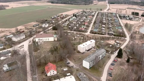 Drone flight over small rural vilage Umurga during spring time, Latvia 動画素材 152717758