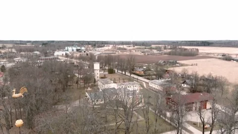 Drone flight over small rural vilage Umurga during spring time, Latvia 動画素材 152718295