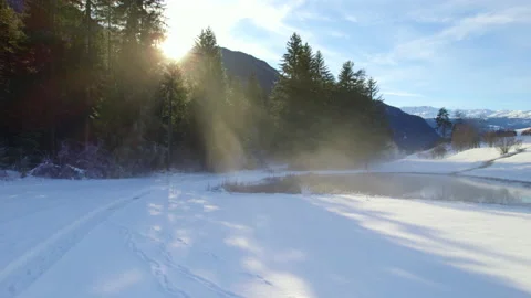 Drone flight over a snow-covered, idyllic Swiss landscape Stock Footage 167881457