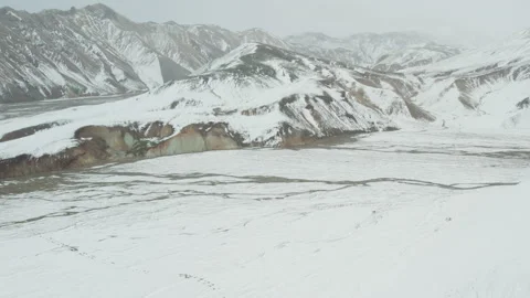 Drone Flight Over Snow Covered Landscape Towards Mountains Stock Footage 168774181
