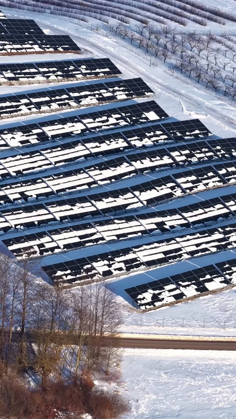 Drone Flight Over a Snow Covered Solar Farm in Rural Winter Landscape Stock Footage 337141016