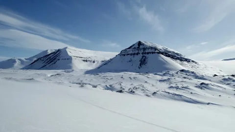 Drone flight over snow covered mountains in the remote interior of Svalbard Stock Footage 340037337