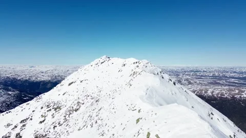 Drone flight over snow mountain ridge. Norway 15% view Stock-Footage 319476553