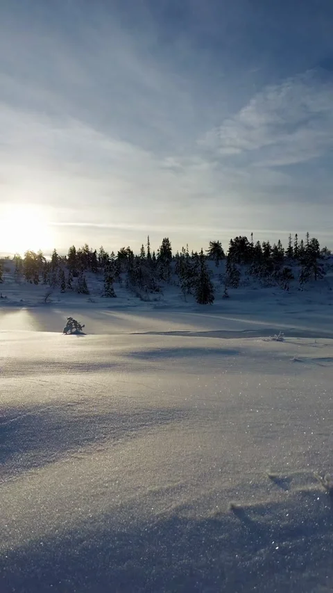 Drone flight over snowworld. Large ice lake ahead, towards the early sun. Stock-Footage 319501271