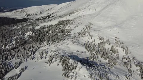 Drone flight over snowy Carpathian ridge with tourist footprints Stock Footage 327391880