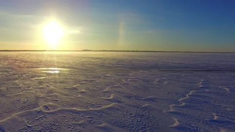Drone flight over the snowy frozen lake Stock Footage