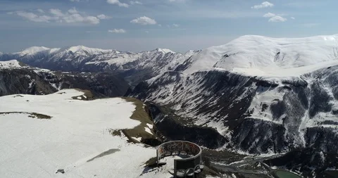 Drone flight over snowy mountain peaks in Georgia Stock Footage 129563991