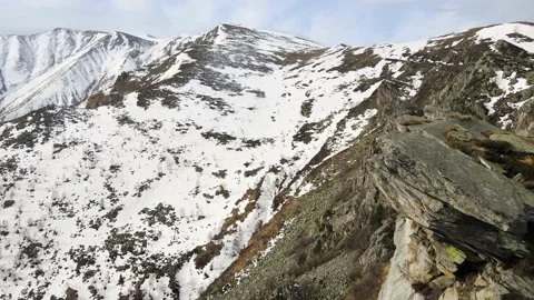 Drone flight over the snowy mountain in winter. peak and ridge view, alps 4k Stock Footage 152578367