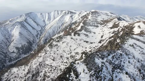 Drone flight over the snowy mountain in winter. peak and ridge view, alps 4k Stock Footage 152578372