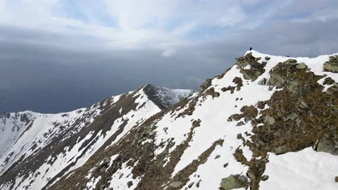Drone flight over the snowy mountain in winter. peak and ridge view, alps 4k Stock Footage 152578396