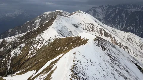 Drone flight over the snowy mountain in winter. peak and ridge view, alps 4k Stock Footage 152578443