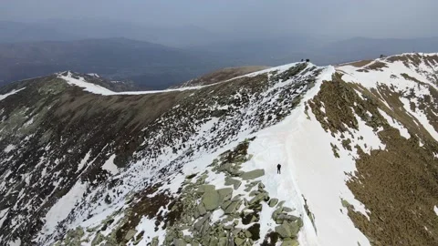 Drone flight over the snowy mountain in winter. peak and ridge view, alps 4k Stock Footage 152578447