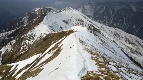 Drone flight over the snowy mountain in winter. peak and ridge view, alps 4k Stock Footage 152578468
