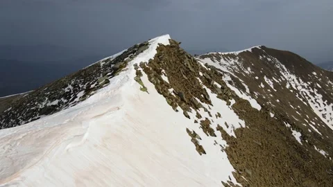 Drone flight over the snowy mountain in winter. peak and ridge view, alps 4k Stock Footage 152578472