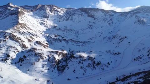 Drone flight over snowy mountains of Cerler ski resort in Husca (Spain) Stock Footage 221836084