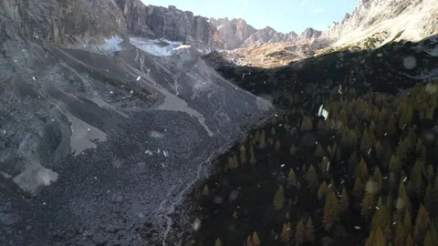 Drone Flight Over Snowy Mountains with Falling Snow Stock Footage 330279079