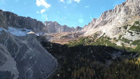 Drone Flight Over Snowy Mountains with Falling Snow Stock Footage 330279998