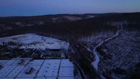Drone flight over snowy roofs of warehouses in American countryside. Blue hour Vídeo Stock 328793449