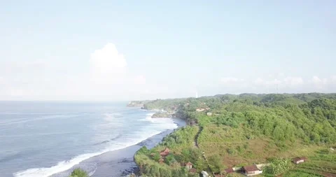 Drone flight over the south beach of java island indonesia when the first Stock Footage 202523767
