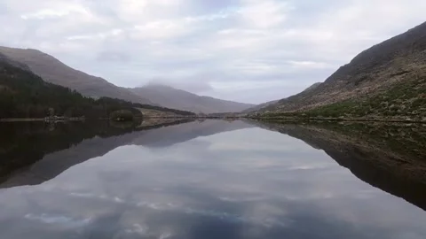 Drone flight over still Irish Lake Stock Footage 190921223