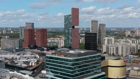Drone flight over Stratford Westfield shopping centre toward Manhattan Loft Stock Footage 345621545